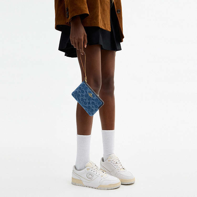 COACH - MUÑEQUERAS (CORNER ZIP WRISTLET)