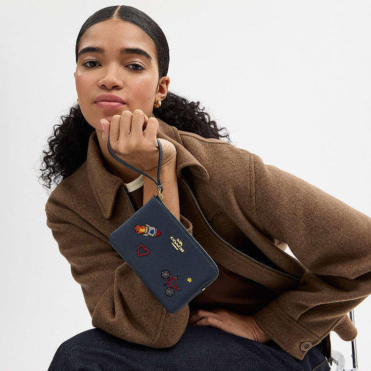 COACH - MUÑEQUERAS (CORNER ZIP WRISTLET)