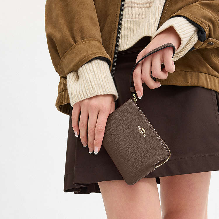 COACH - MUÑEQUERAS (CORNER ZIP WRISTLET)